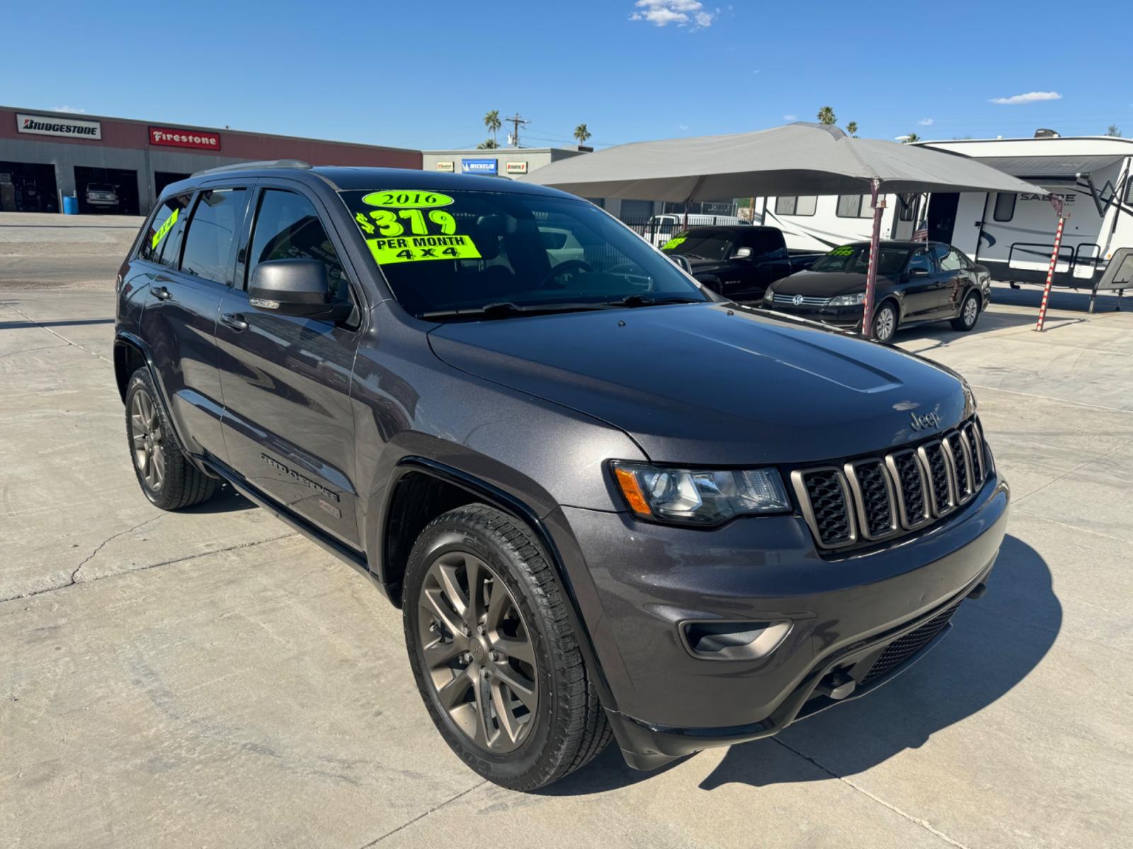 2016 grey Jeep Grand Cherokee (1C4RJFBG0GC) , located at 2190 Hwy 95, Bullhead City, AZ, 86442, (928) 704-0060, 0.000000, 0.000000 - 75th anniversary edition. clean carfax. jeep grand cherokee limited 4 wd. Leather loaded. 81k miles. free and clear title. - Photo #0